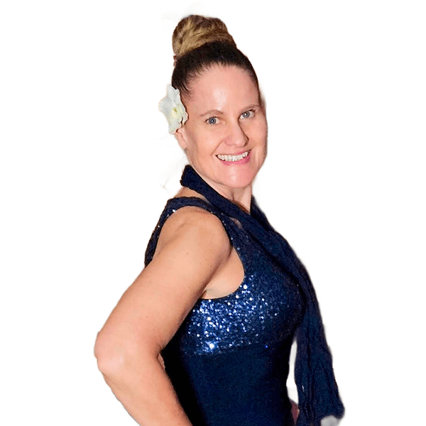 Smiling woman in a sparkling blue top with a flower in her hair.